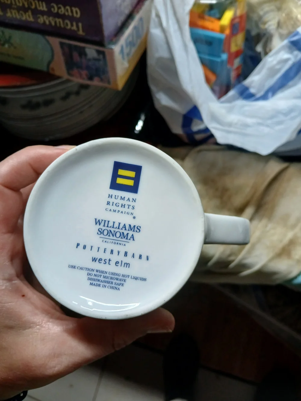 white Williams Sonoma ceramic mug features 